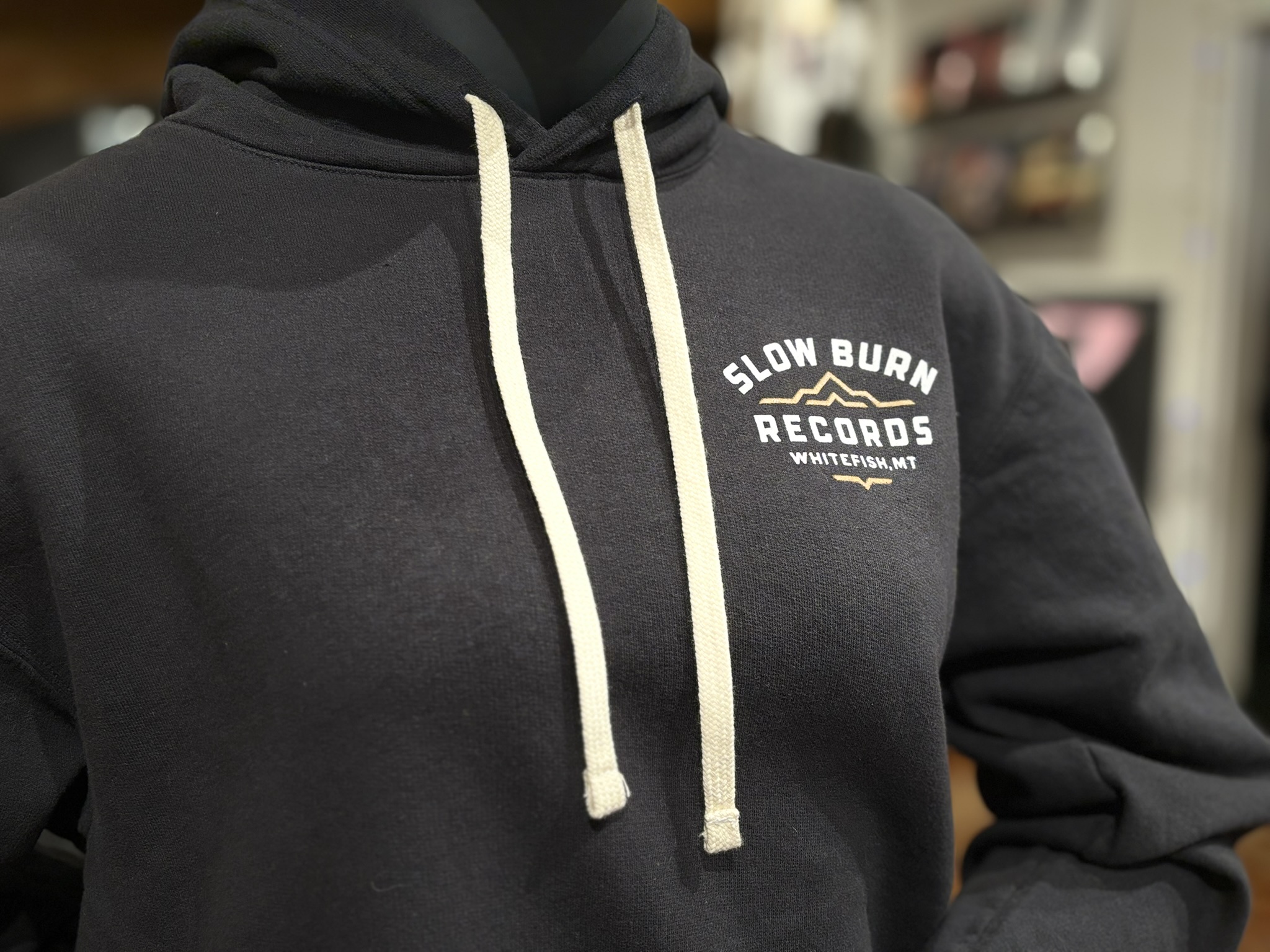 Close-up of small SBR sweatshirt logo on front of sweatshirt