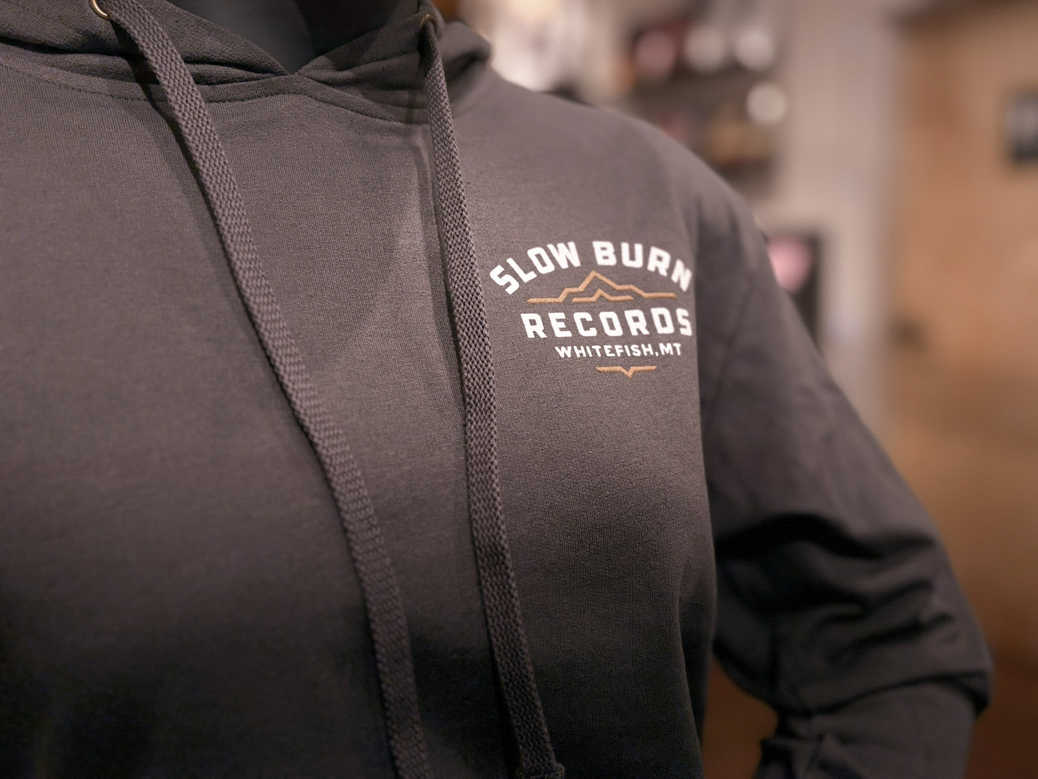Close-up of small SBR logo on sweatshirt front